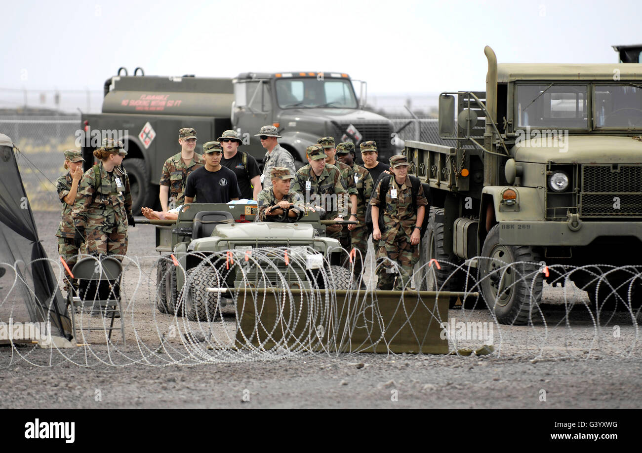 Medical personnel transport patients to a nearby clinic. Stock Photo