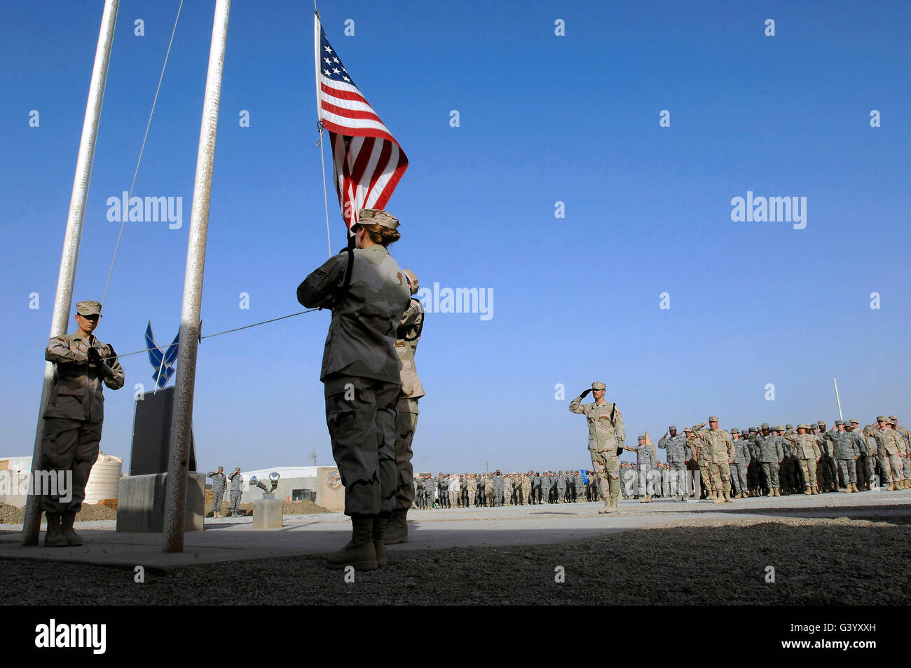 Airmen hold a retreat ceremony to remember the price of freedom. Stock Photo