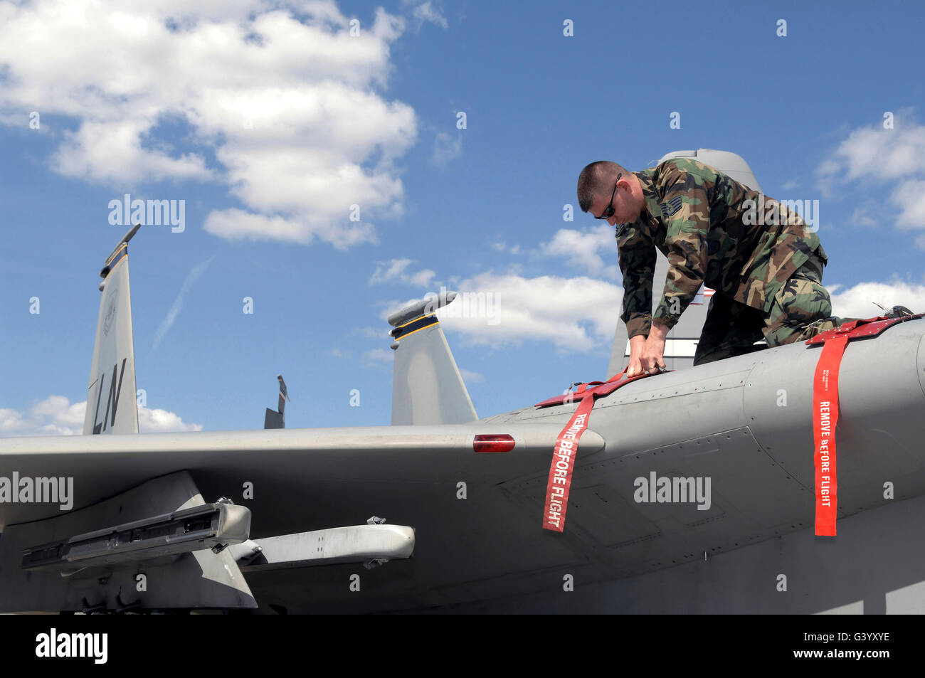 A soldier preparing a F-15E Strike Eagle. Stock Photo