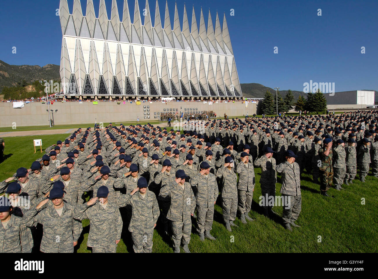 The Class of 2012 salutes during a reveille ceremony. Stock Photo