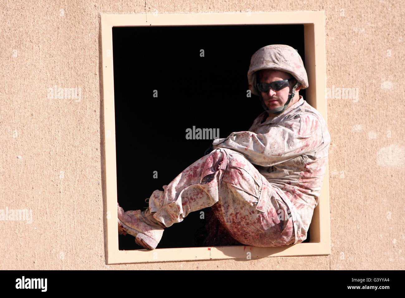 A Marine role player sits in a window. Stock Photo
