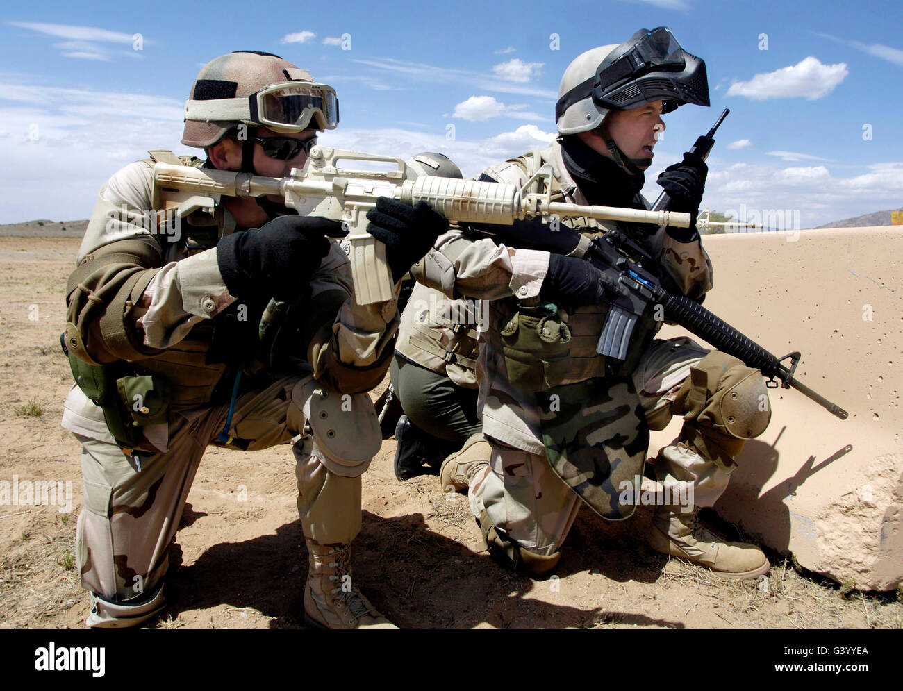 Soldiers respond to a threat in a combat skills training course Stock Photo