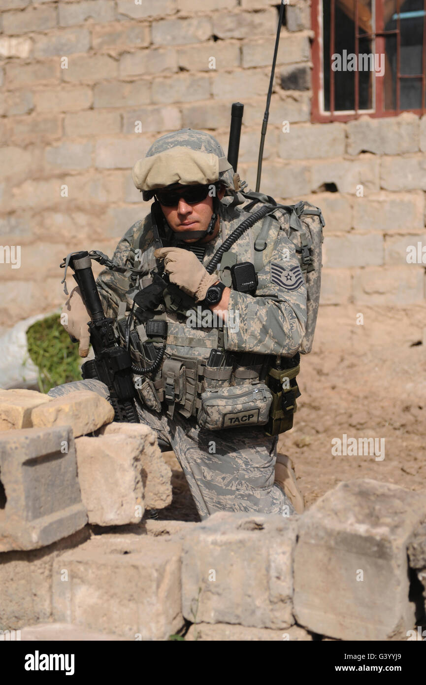 A soldier communicates his location. Stock Photo