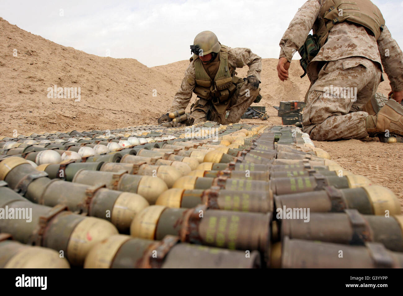 Soldiers arrange unexploded ordinance for demolition at Camp Fallujah, Iraq. Stock Photo