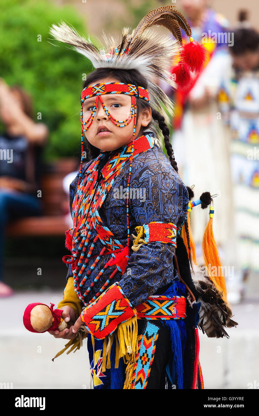 Banff, Canada - July 3, 2014: A young native Blackfoot indian dancer gets ready for his performance during the Banff Festival. Stock Photo