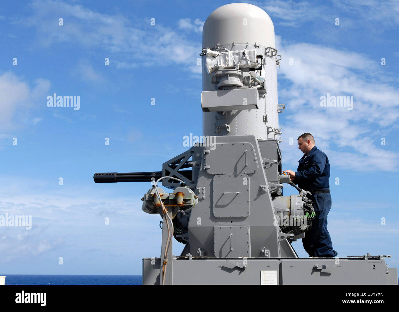 Fire Controlman working on the Phalanx Mark 15 Close-In Weapon System aboard USS Nashville. Stock Photo