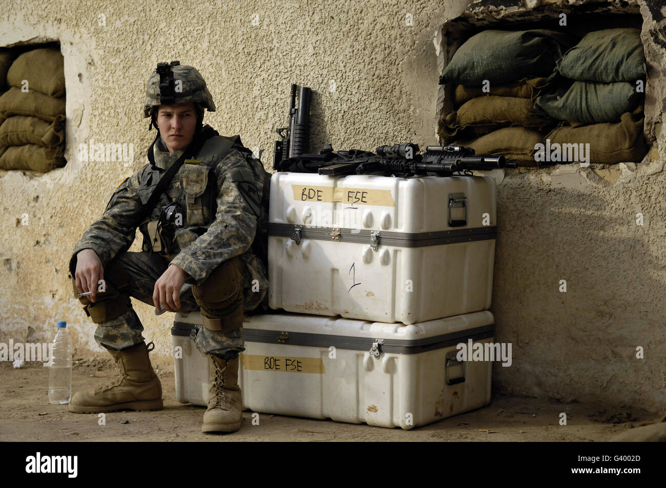 U.S. Army soldier relaxing before going on a joint foot patrol with Iraqi army soldiers in Buhriz, Iraq. Stock Photo