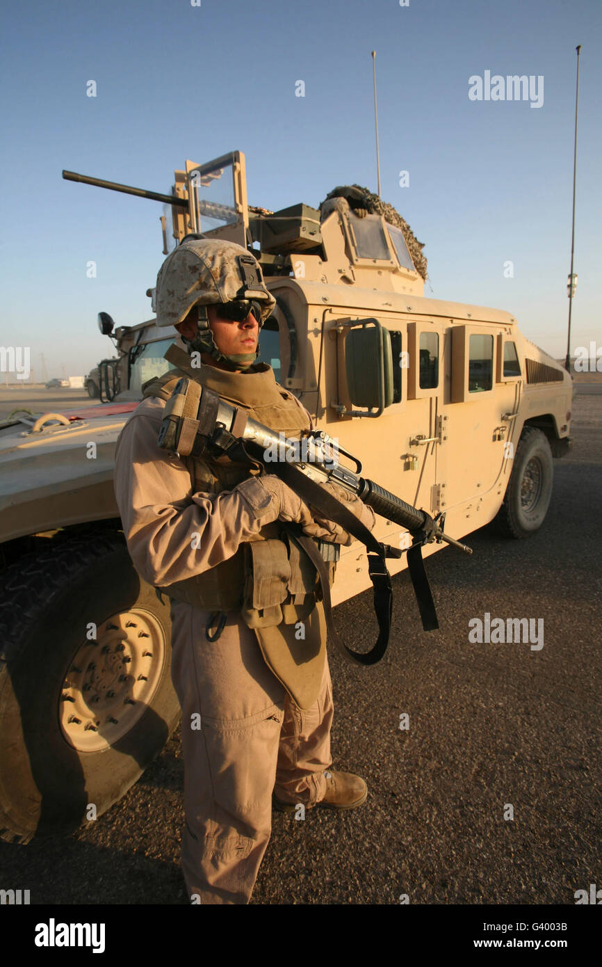 A U.S. Marine providing security during a stop outside of Camp Taqaddum, Iraq. Stock Photo