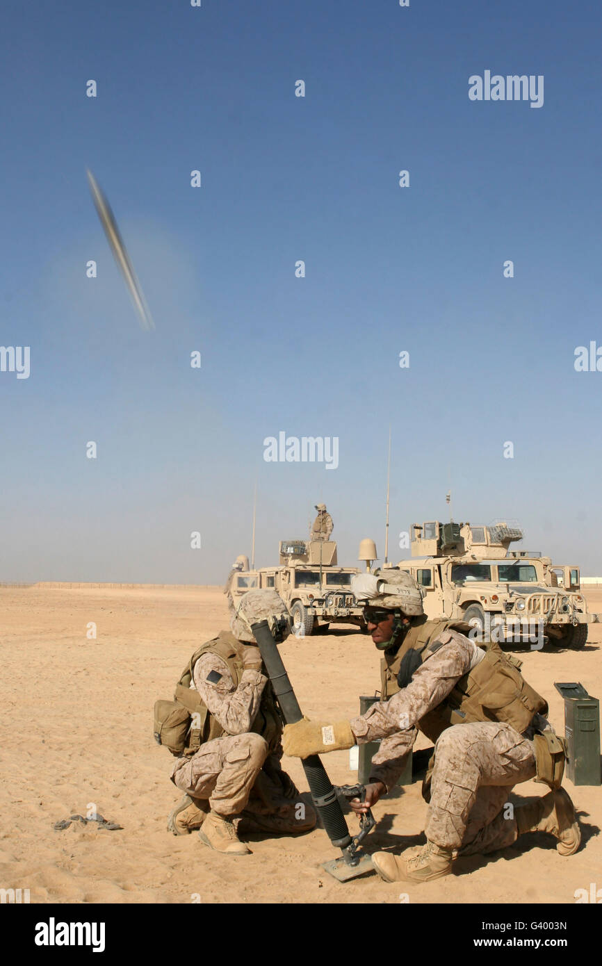 U.S. Marines firing a 60-mm mortar system outside of Camp Bastion, Afghanistan. Stock Photo