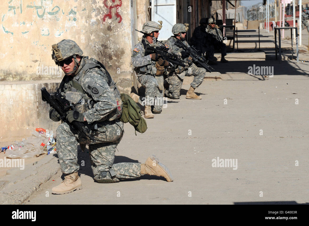 U.S. Army soldiers providing security during a patrol in Siniyah, Iraq. Stock Photo