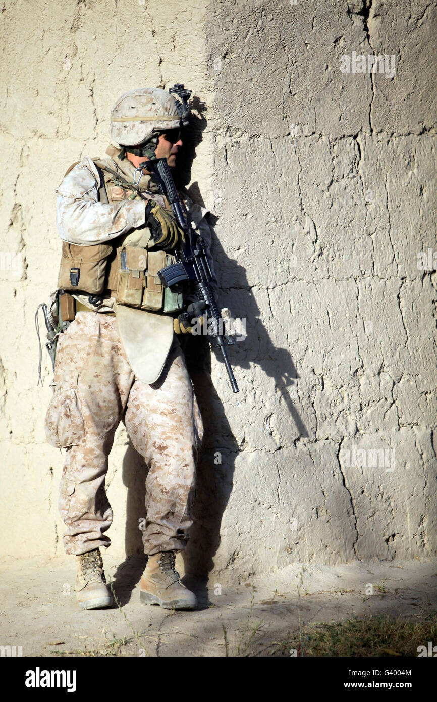 U.S. Marine providing security during a road reconnaissance patrol in Afghanistan. Stock Photo