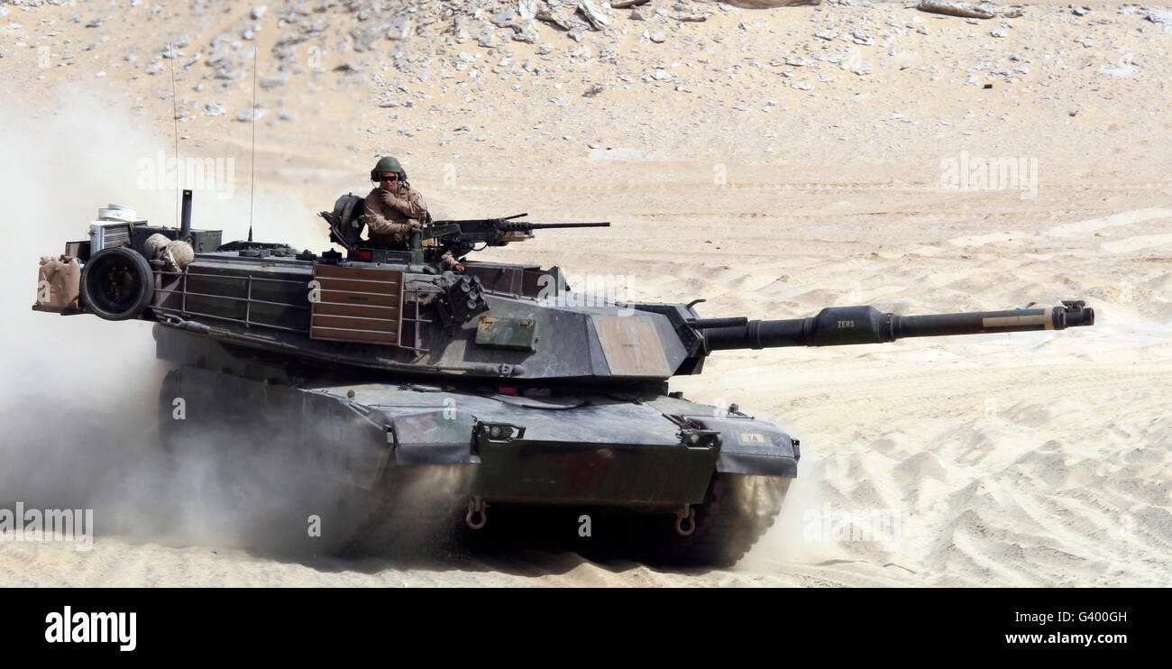 An M1-A1 Abrams Main Battle Tank rumbles across a live-fire range. Stock Photo