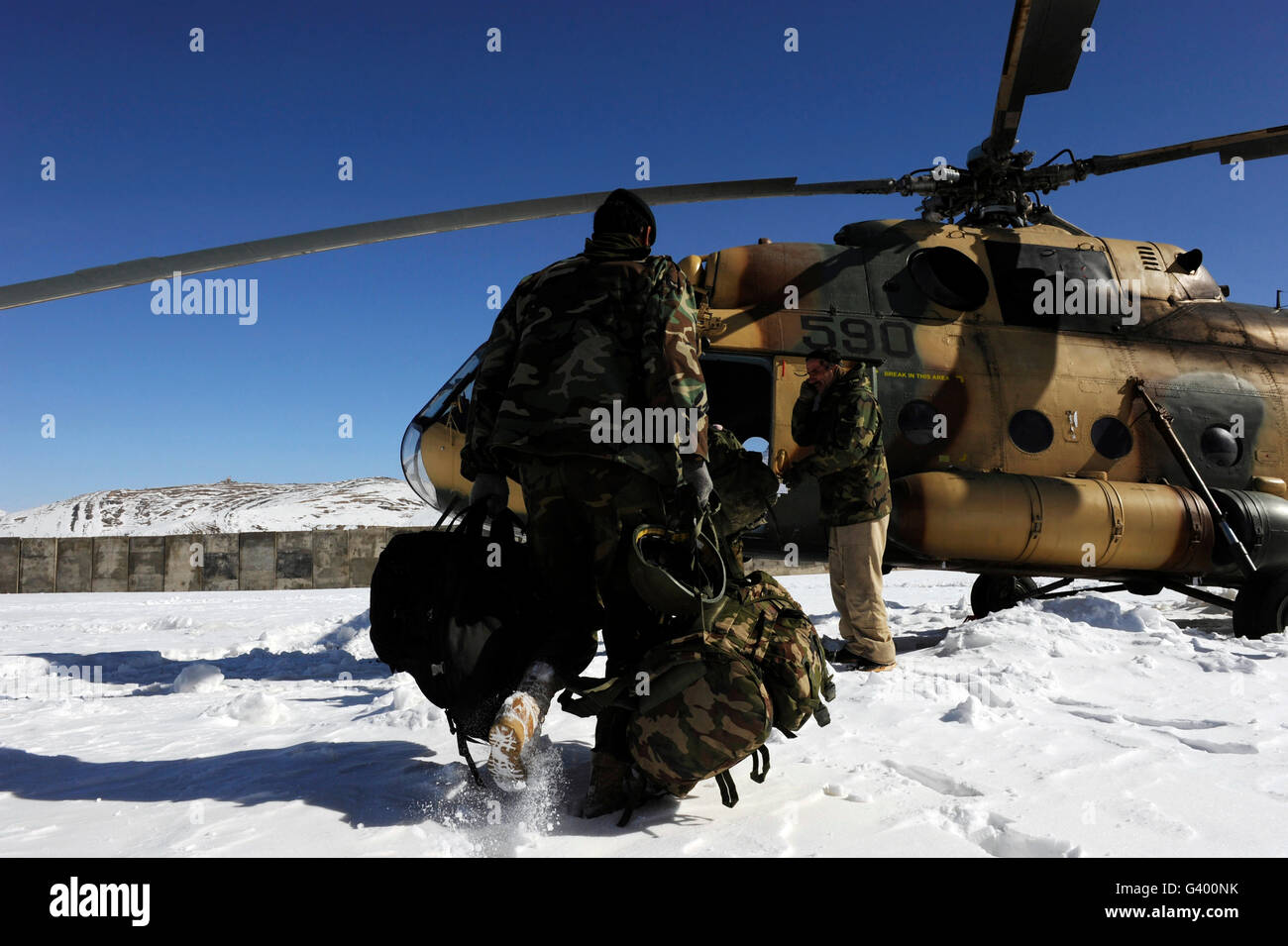 Afghan National Army Air Corps members board a Mi-17 helicopter. Stock Photo