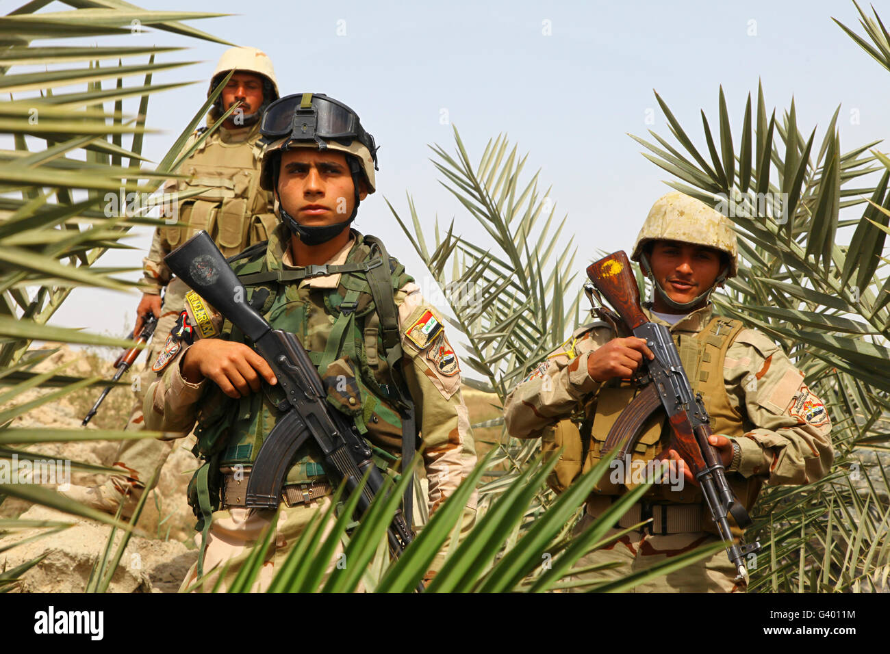 Iraqi soldiers conduct a foot patrol in Al Madinia, Iraq. Stock Photo