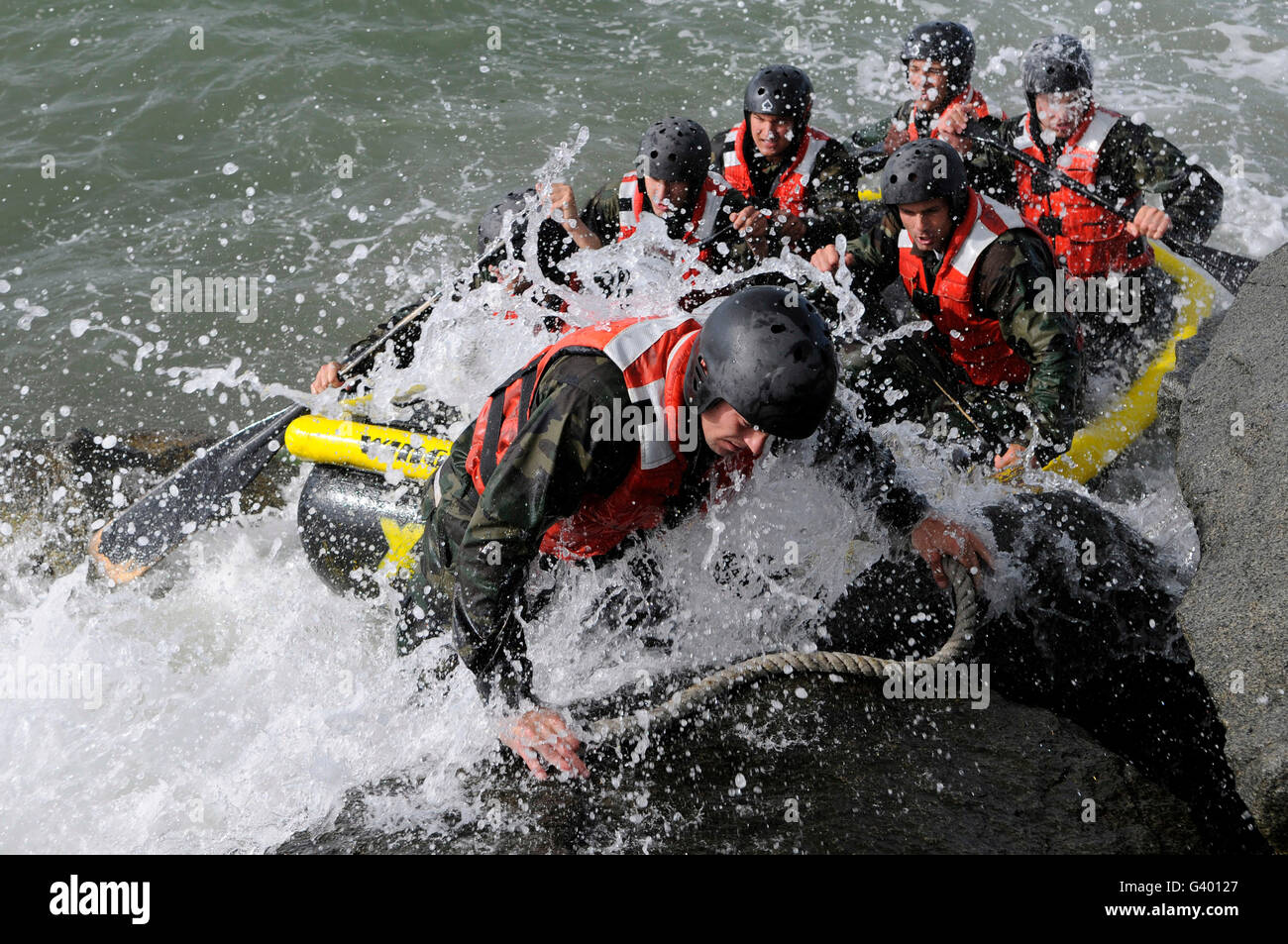 Students in Basic Underwater Demolition/SEAL participate in rock portage in Coronado, California. Stock Photo