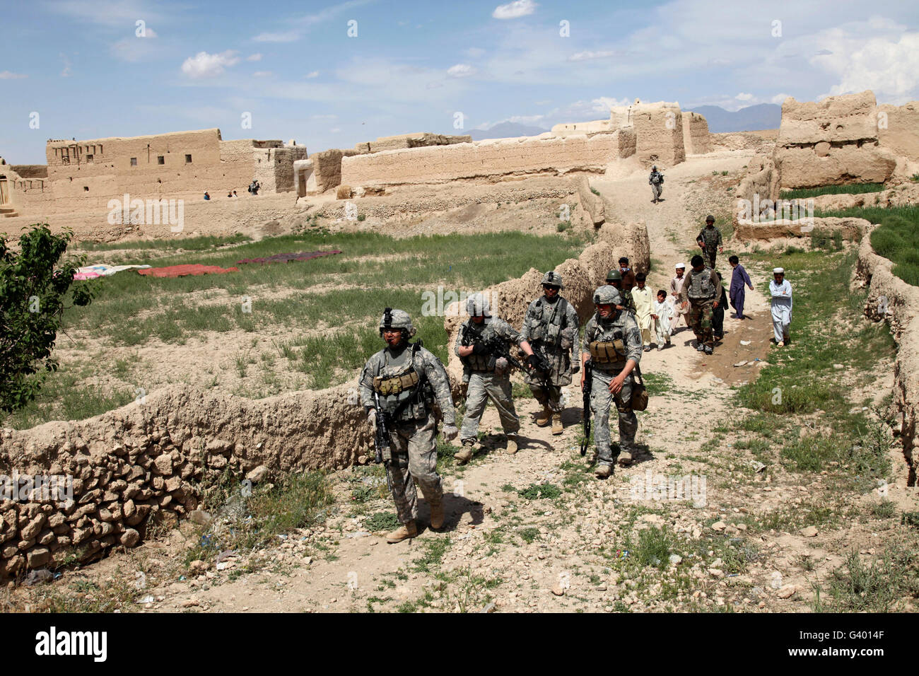 U.S. Soldiers conduct a dismounted patrol to a mosque in the village of Bidak in Logar, Afghanistan. Stock Photo