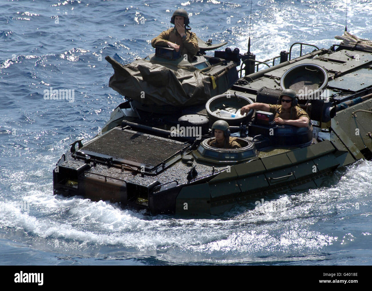 An Amphibious Assault Vehicle approaches an amphibious transport dock ship. Stock Photo