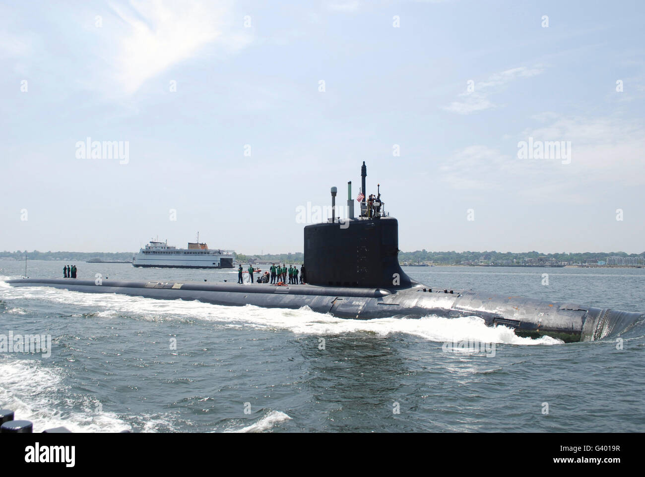 The Virginia-class attack submarine USS New Mexico transits the Thames River in Connecticut. Stock Photo