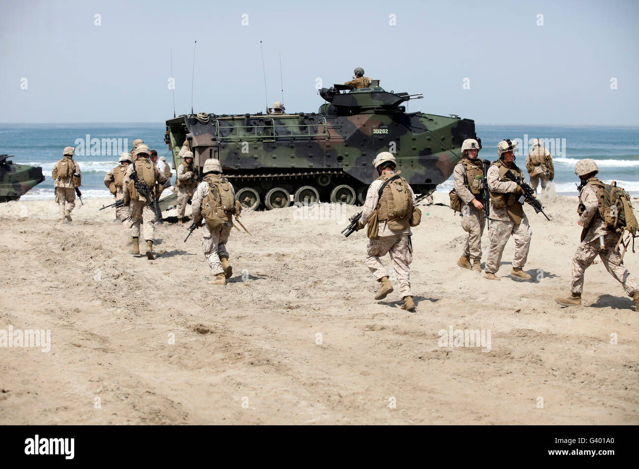 U.S. Marines return to their amphibious assault vehicles on Camp Pendleton, California. Stock Photo