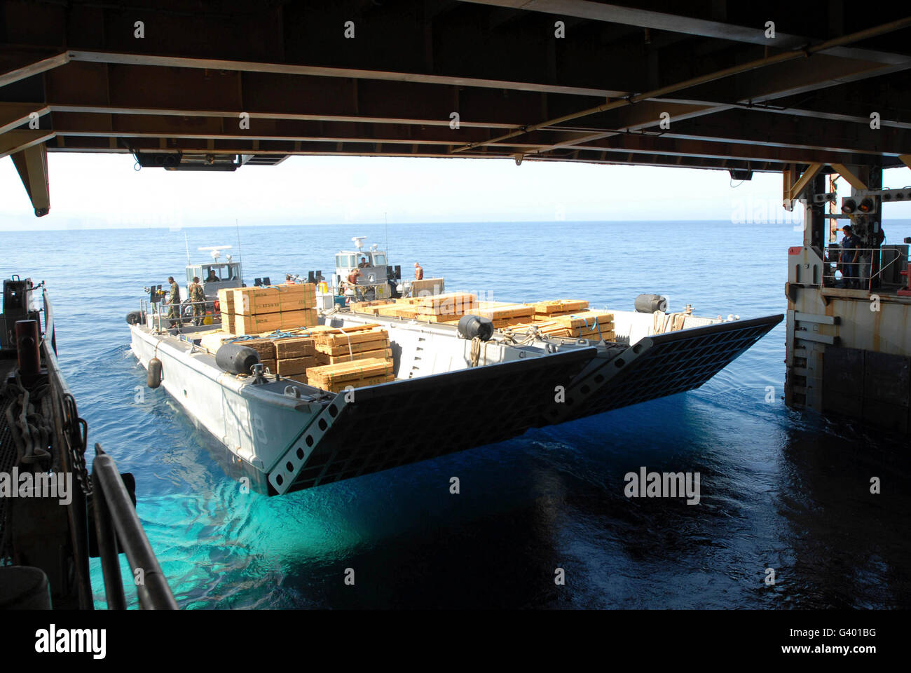 Landing craft mechanized boats depart the amphibious dock landing ship USS Fort McHenry. Stock Photo