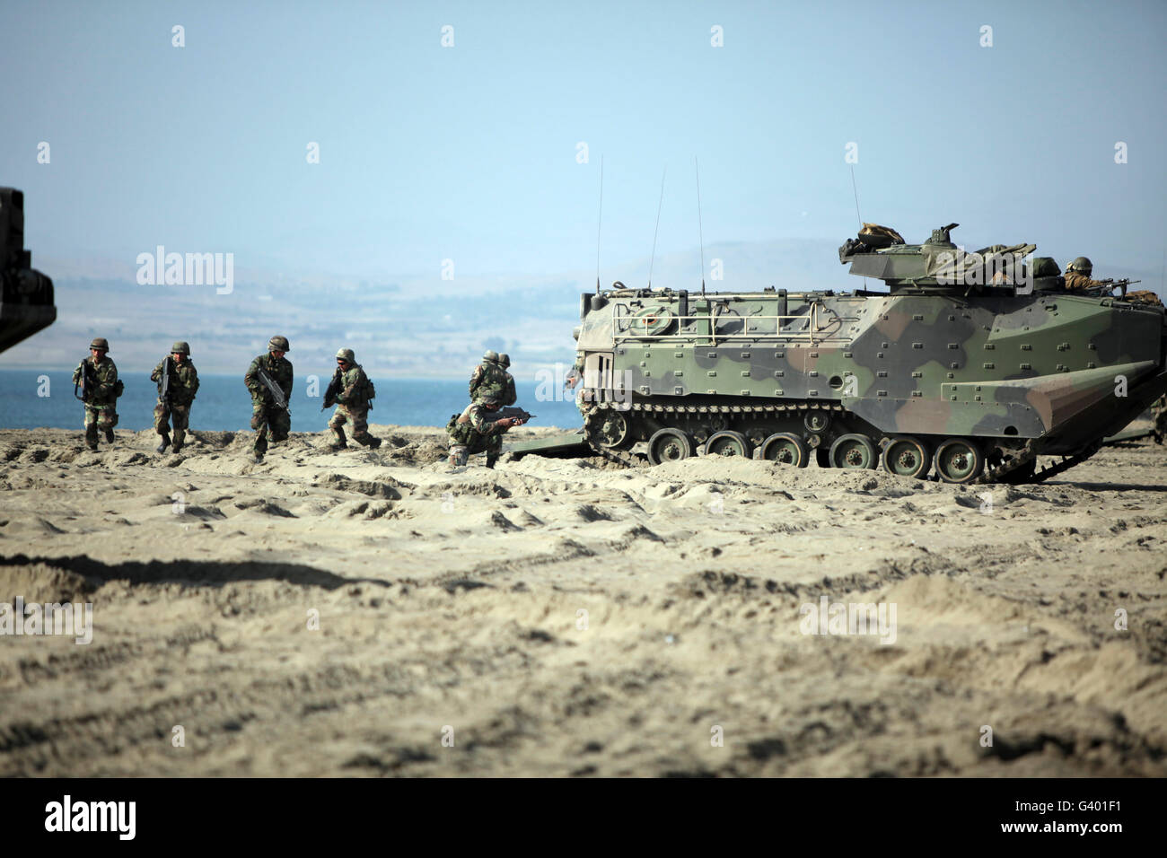 Peruvian Marines disembark amphibious assault vehicles while conducting a beach assault. Stock Photo