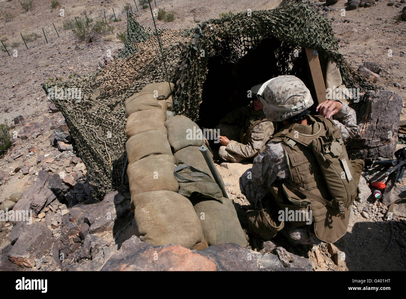 Marines provide security over the Combat Logistics Support Area. Stock Photo