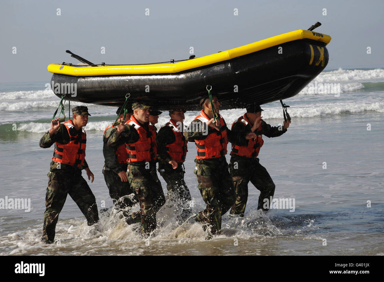 Basic Underwater Demolition/SEAL students work together during small boat training. Stock Photo