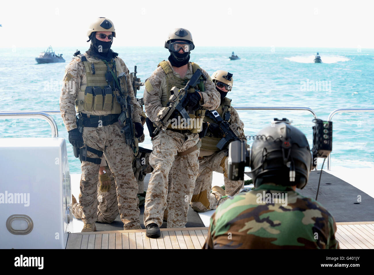 U.S. Navy SEALs prepare to take down a yacht in the Gulf of Mexico off of Key West, Florida. Stock Photo