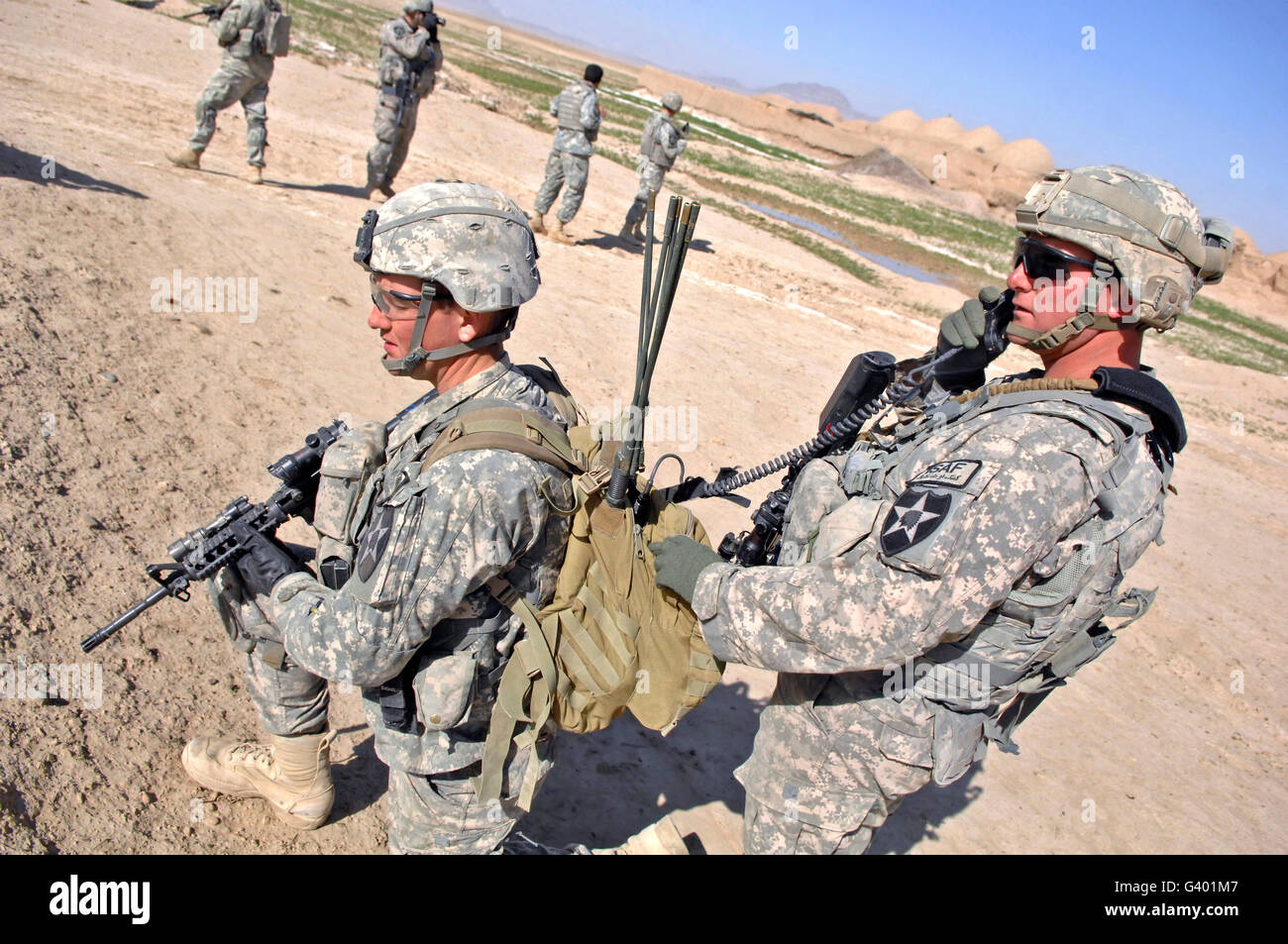 U.S. Army soldiers call in an update during a humanitarian assistance mission in Afghanistan. Stock Photo