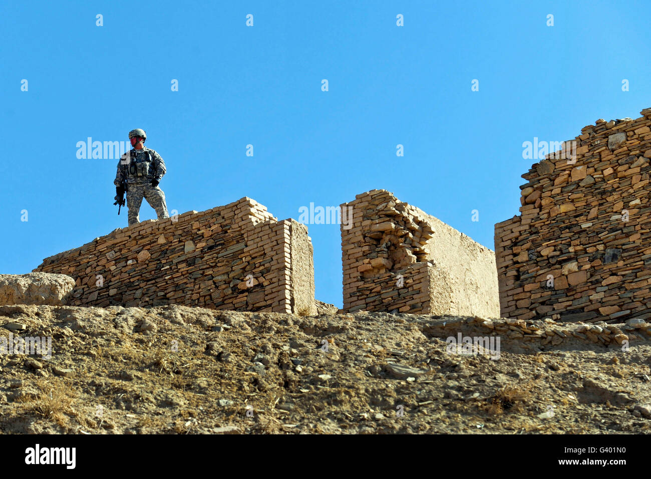 U.S. Army soldier stands guard in Afghanistan. Stock Photo