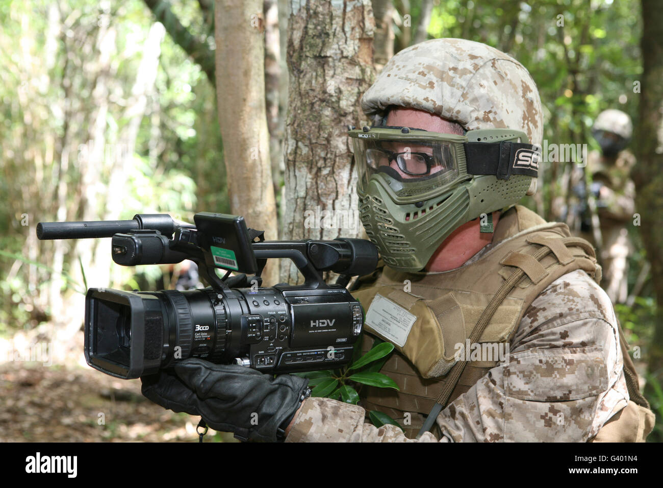 U.S. Marine videotapes combat exercises at Camp Gonsalves, Japan. Stock Photo