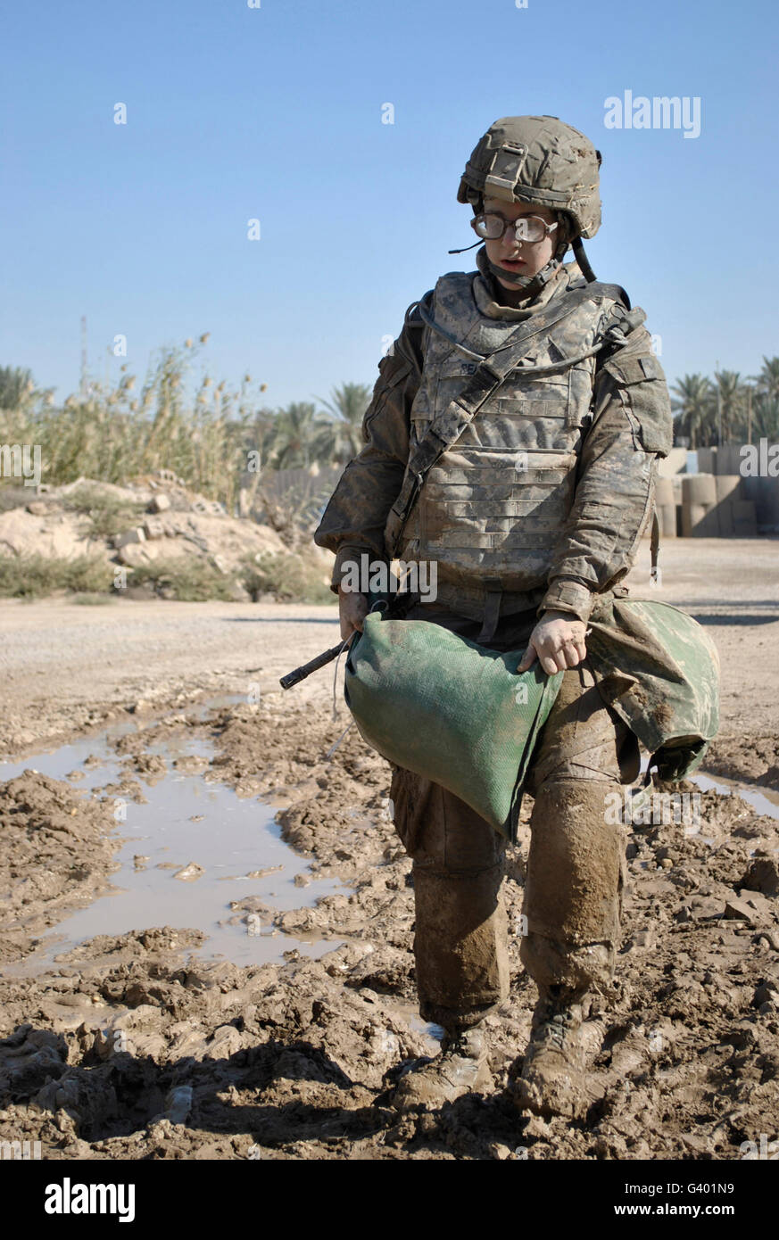Female Airman carries a sandbag during a competition. Stock Photo