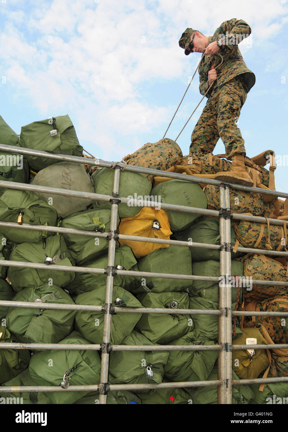 A Marine ties down sea bags during exercise Cobra Gold 2011. Stock Photo