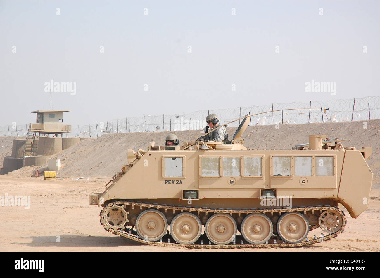 Soldiers patrol in an M-113 Armored Personnel Carrier. Stock Photo