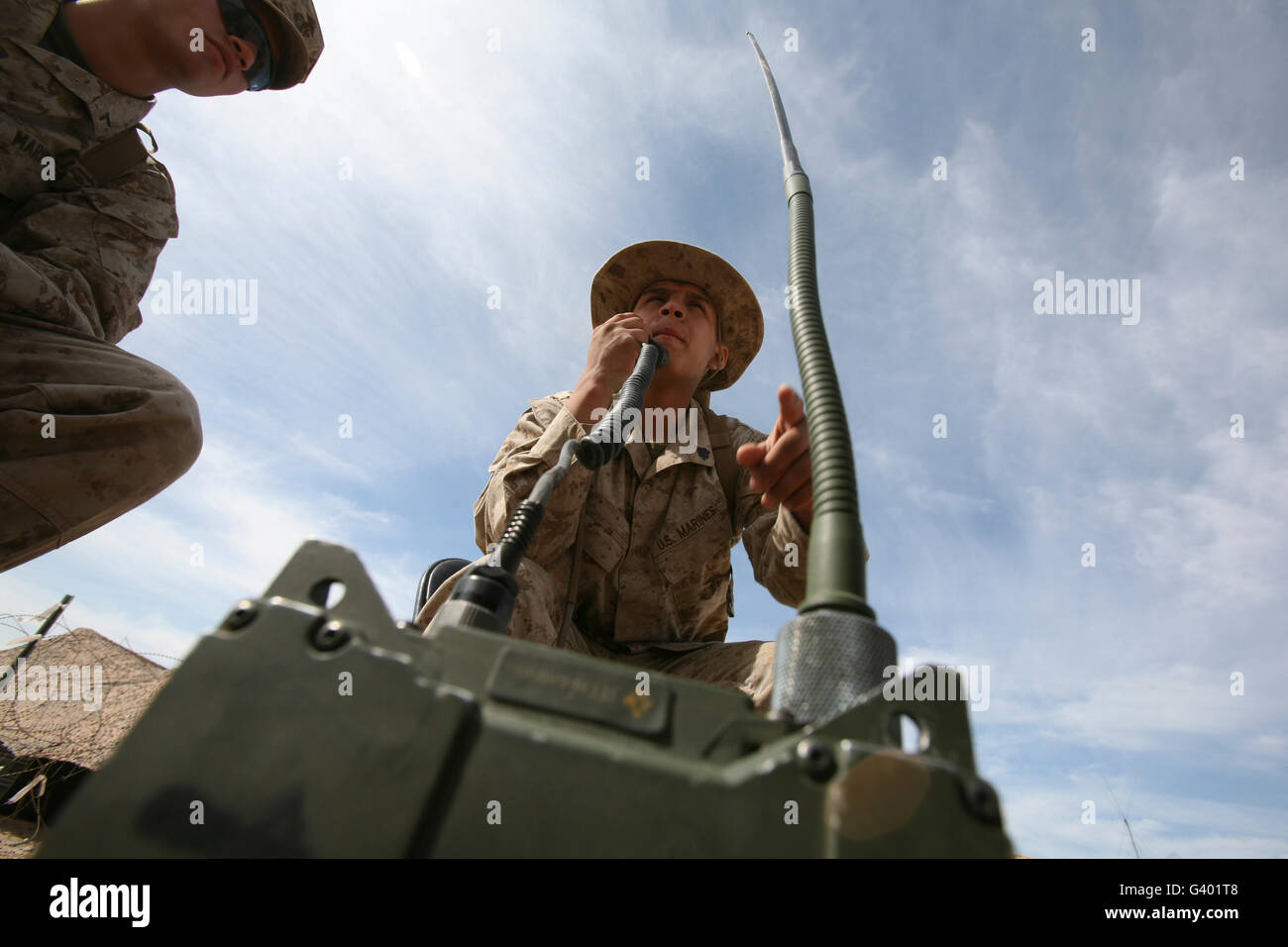 An officer conducts a radio check. Stock Photo