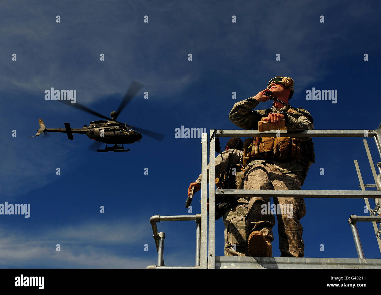 A Joint Terminal Attack Controller communicates a close air support mission. Stock Photo