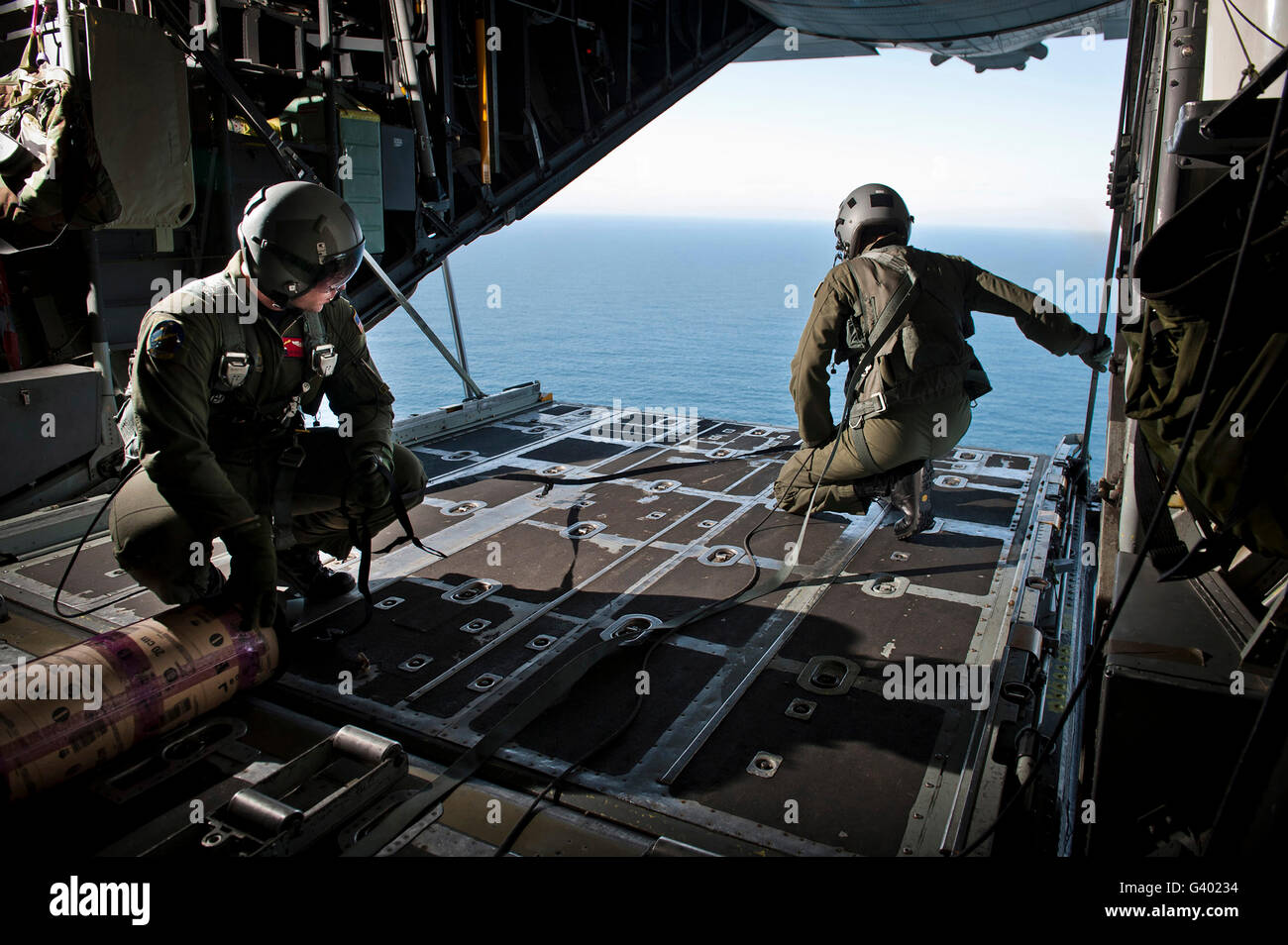 Airmen wait for the signal to deploy a buoy from a C-130 Hercules. Stock Photo