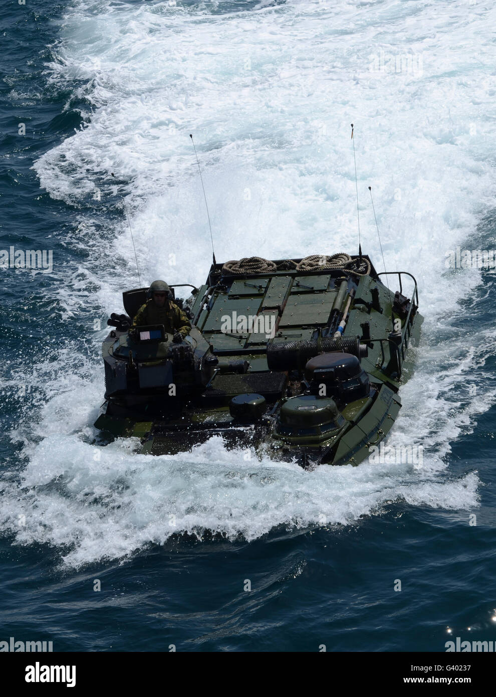 An amphibious assault vehicle approaches the well deck of USS Iwo Jima. Stock Photo