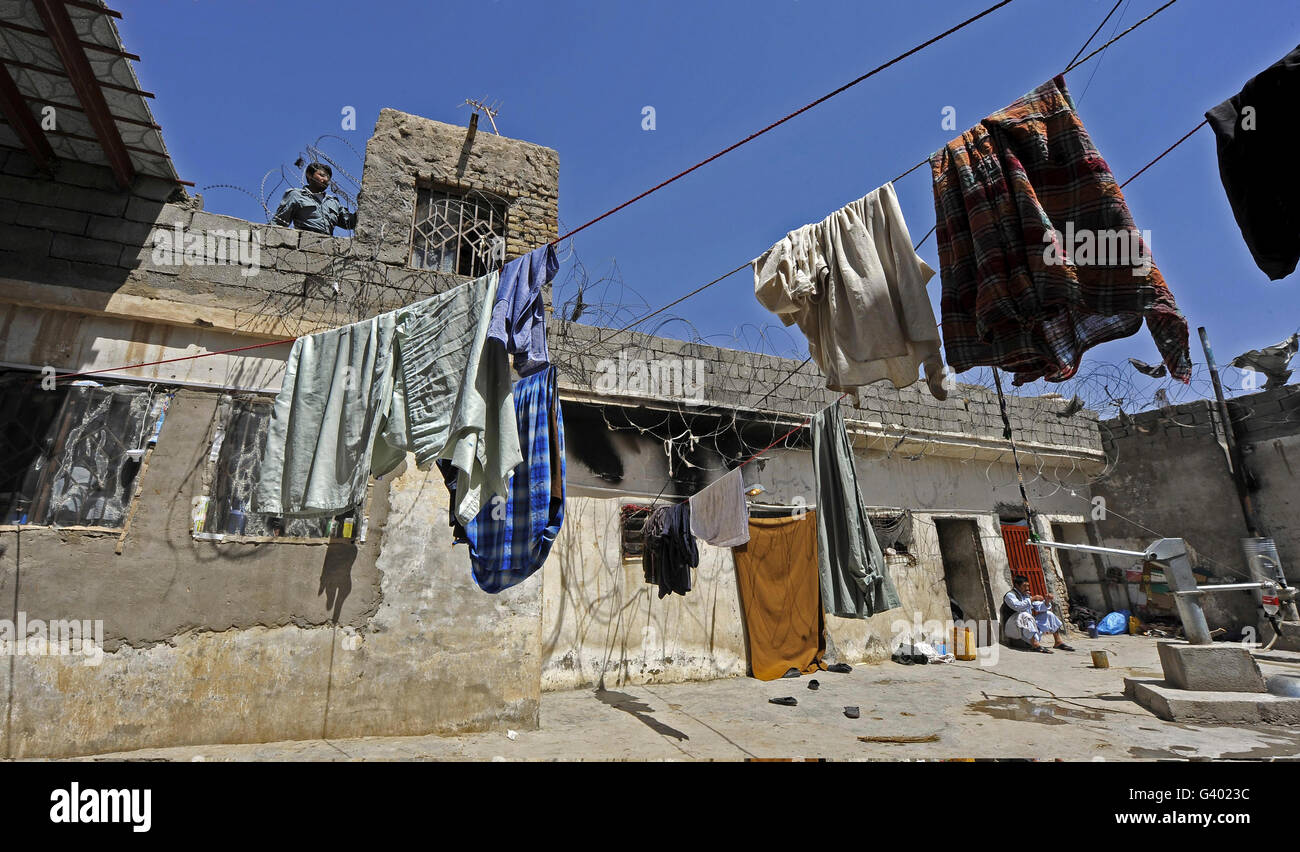 Laundry hangs in the courtyard inside a prison compound in Afghanistan. Stock Photo