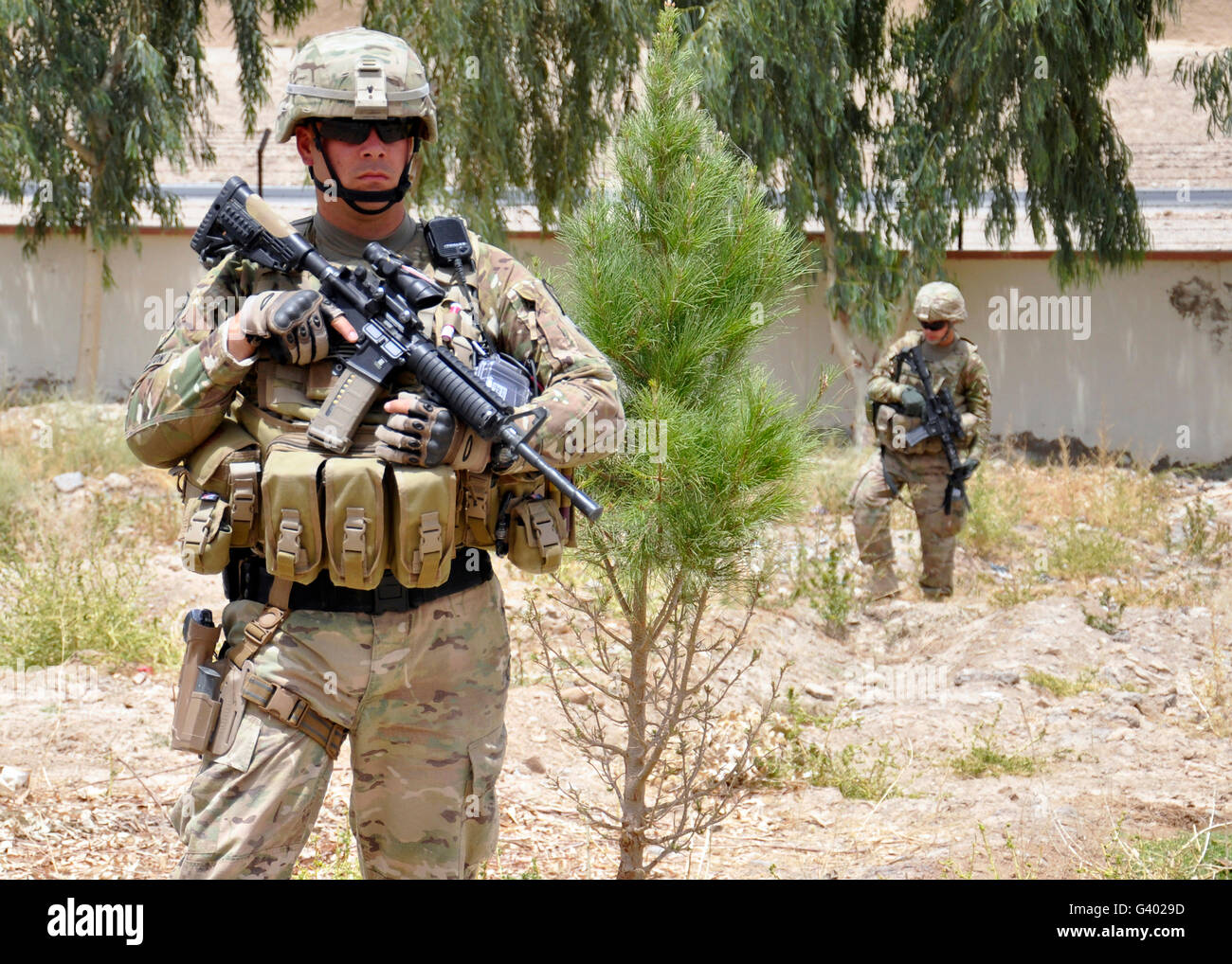 U.S. Army soldier stands guard at a proposed construction site in Afghanistan. Stock Photo