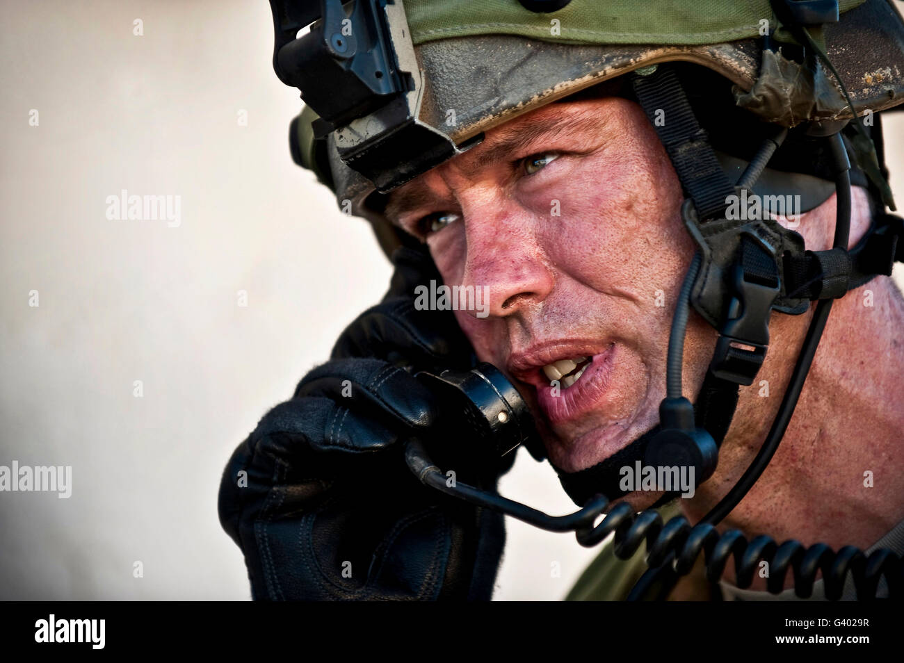 U.S. Air Force Sergeant calls for a simulated air strike. Stock Photo