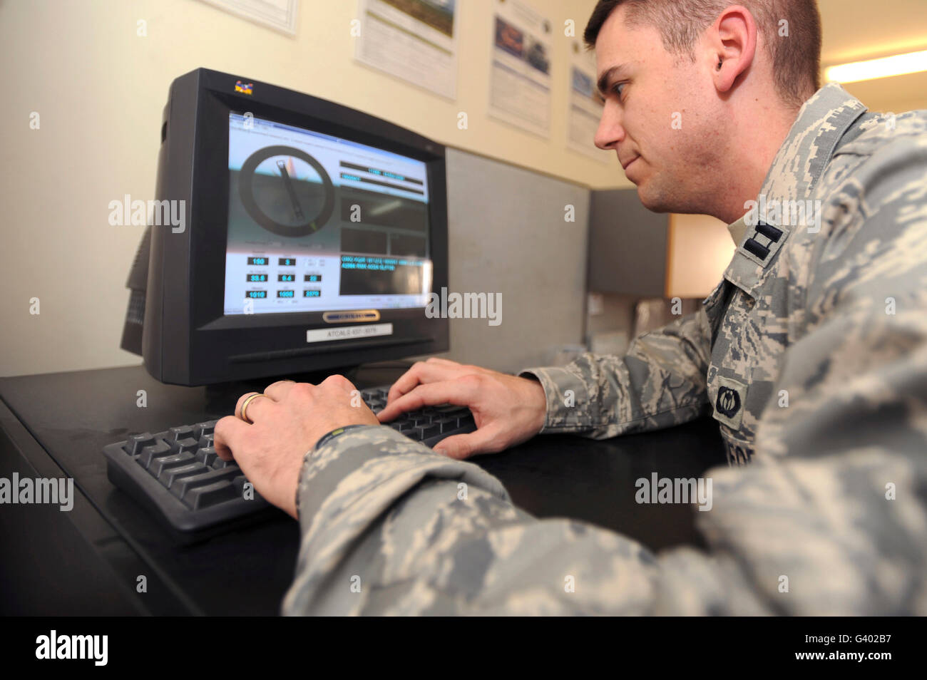 Captain checks readings from an FM-Q19 Airfield Sensor. Stock Photo