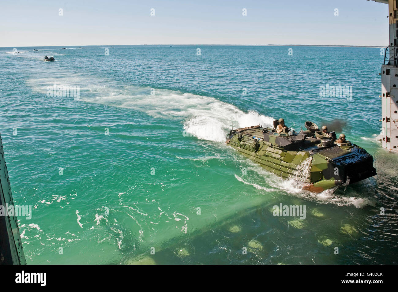 Amphibious assault vehicles enter the well deck of USS New York. Stock Photo