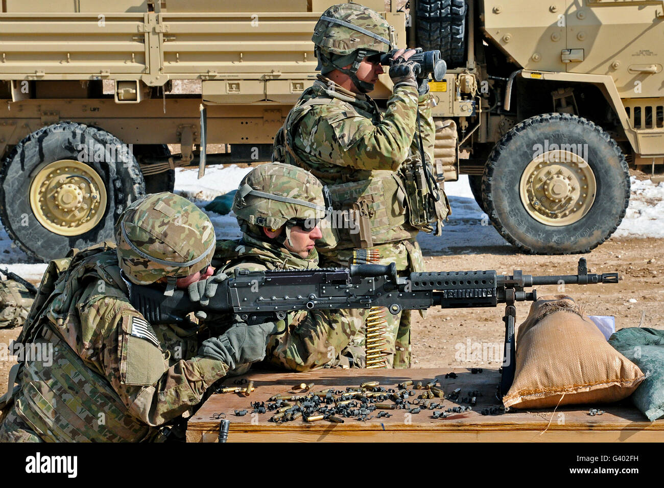 Soldier firing a M240B machine gun. Stock Photo