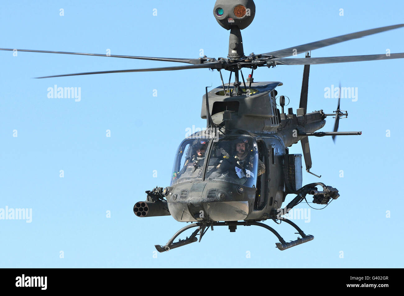 An OH-58 Kiowa takes off over Afghanistan. Stock Photo