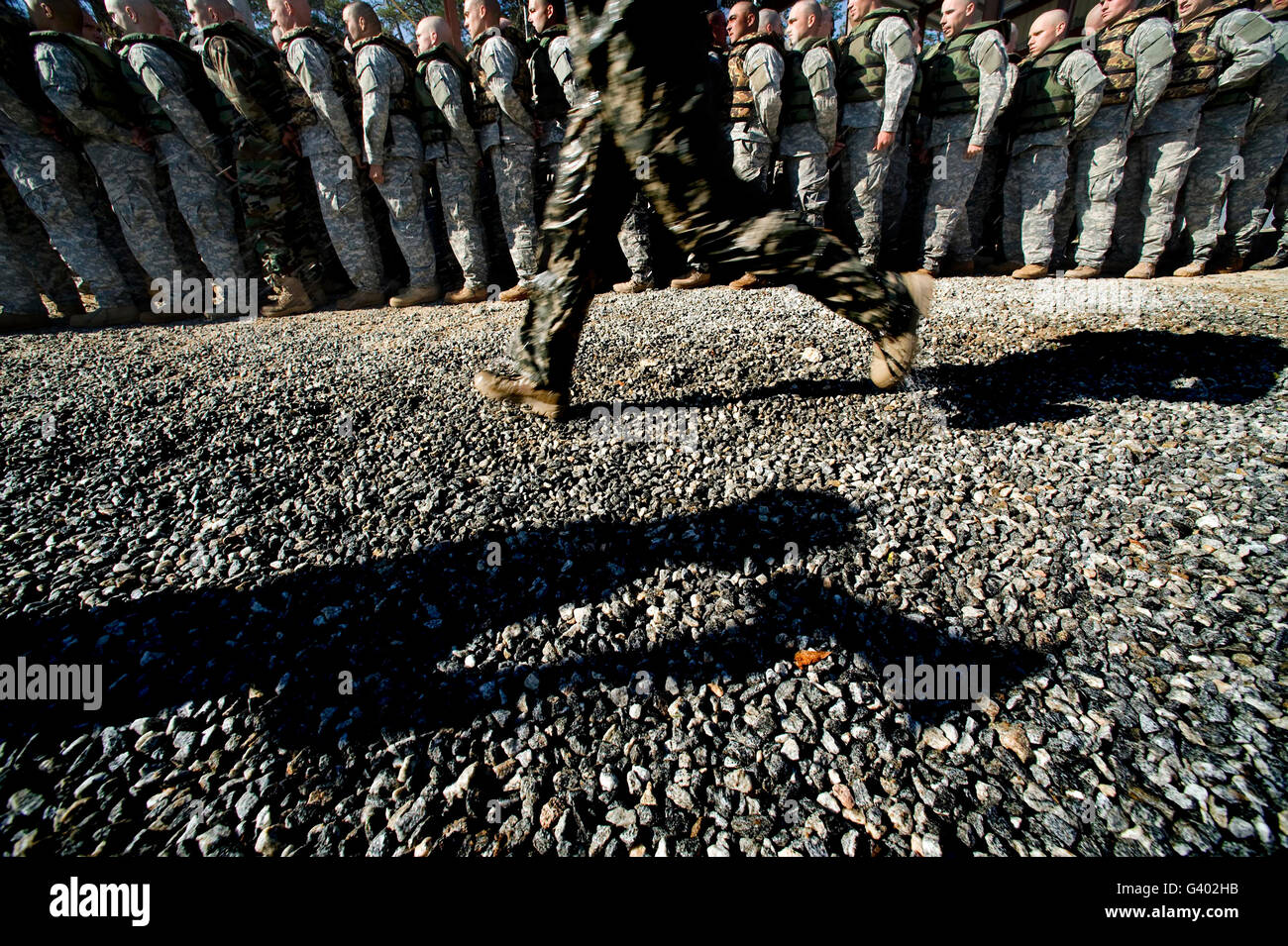 A U.S. Army Ranger School instructor shouts commands to soldiers. Stock Photo