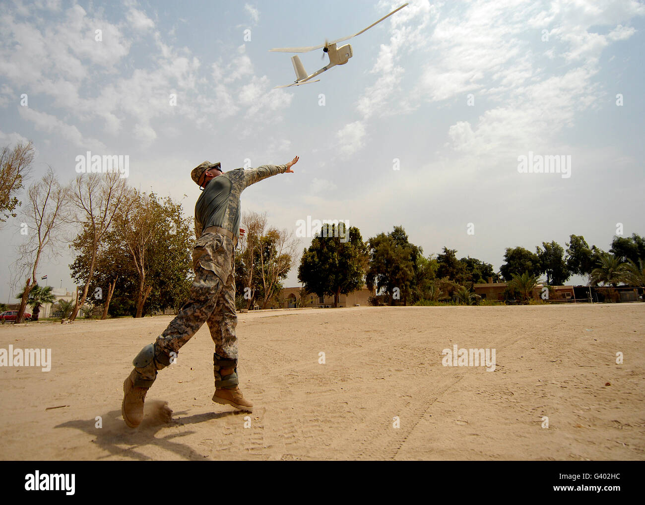 U.S. Army soldier launches an RQ-11B Raven unmanned aerial vehicle. Stock Photo