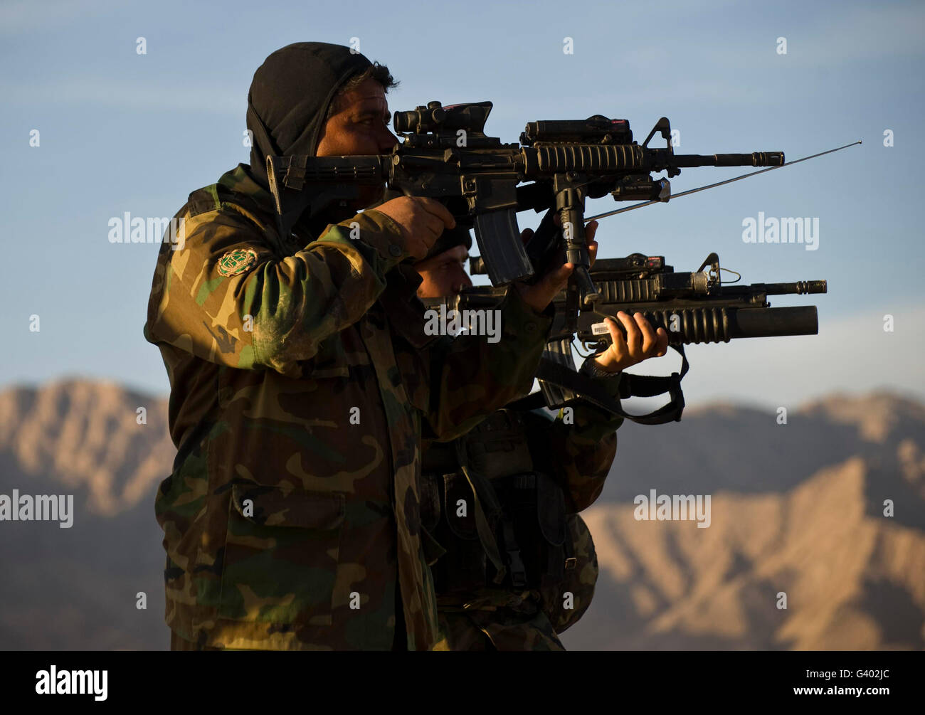 Afghan National Army Commando's aim their weapons. Stock Photo