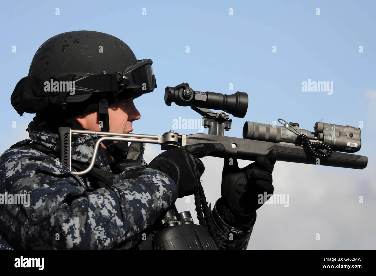 U.S. Navy chief uses an LA9P nonlethal visual disruption laser gun. Stock Photo