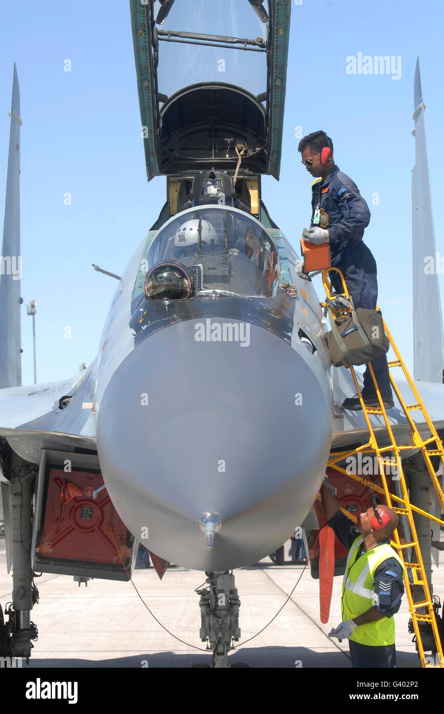 Maintainers prepare a Sukhoi Su-30 aircraft of the Indian Air Force. Stock Photo